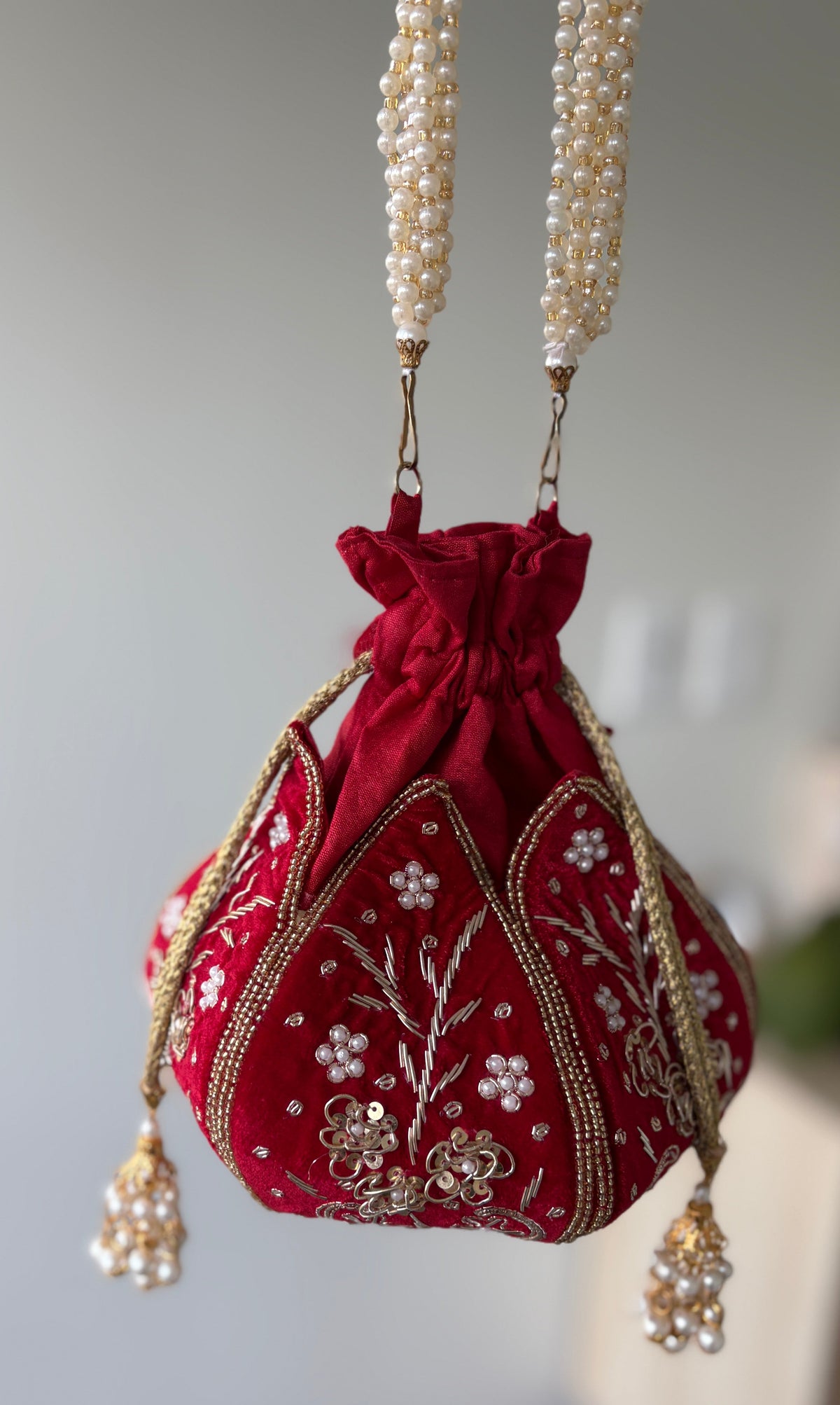 Women Red Embroidered Potli Handbag by  Rang & Rani
