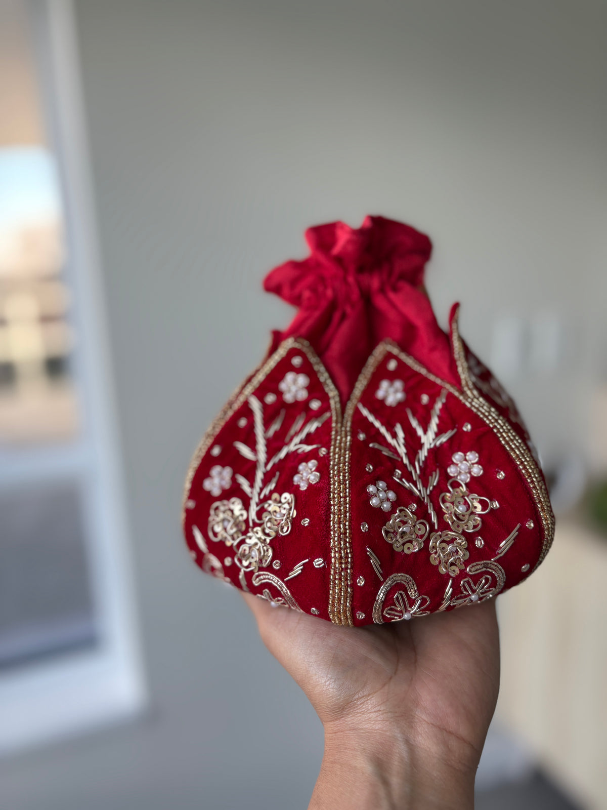 Women Red Embroidered Potli Handbag by  Rang & Rani